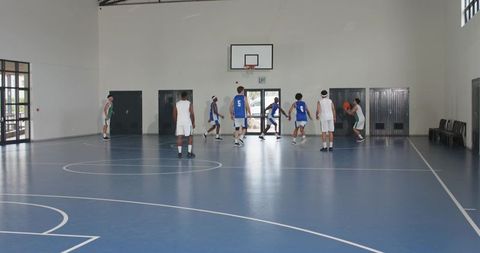 Youth Basketball Game Indoors in Modern Gym