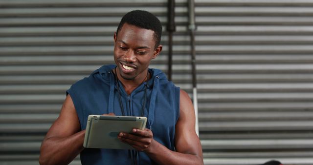 Athletic Man Using Tablet in Modern Gym - Download Free Stock Images Pikwizard.com