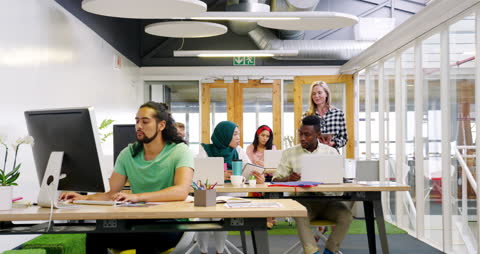 Diverse Team Working in Modern Open Plan Office