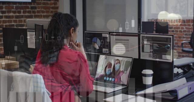 Businesswoman on Video Call in Office, Analyzing Stock Market Data on Screens - Download Free Stock Images Pikwizard.com