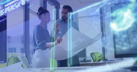 Colleagues Collaborating on Blueprint with Holographic Data in Tech Office