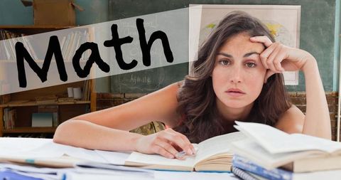 Unmotivated student struggling with math homework in classroom