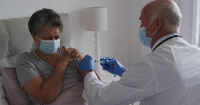 Elderly Woman Receiving Vaccine Injection at Home from Doctor - Download Free Stock Images Pikwizard.com