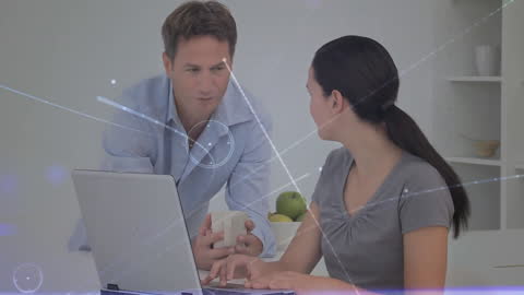 Caucasian Couple Using Laptop with Digital Connection Network