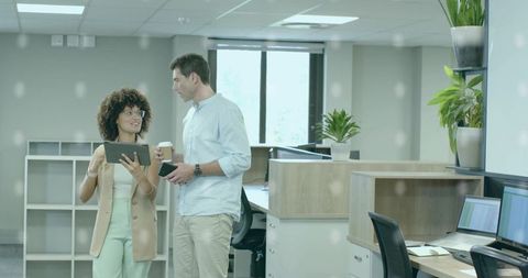 Young Professionals Collaborating in Modern Open Office Environment