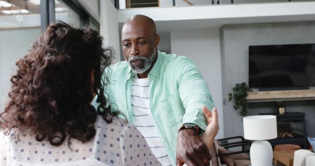 Man and Woman in Serious Interaction at Home - Download Free Stock Images Pikwizard.com