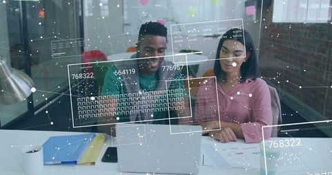 Colleagues Analyzing Data Analytics in Modern Office