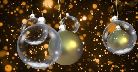 Festive Christmas Baubles with Snow Falling on Black Background