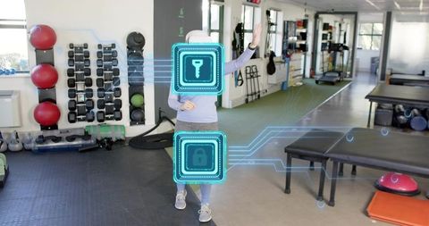 Woman Interacting with Augmented Reality Fitness Interface for Virtual Training in Gym