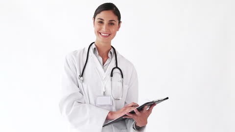 Smiling Female Doctor Holding Clipboard in Blank Space