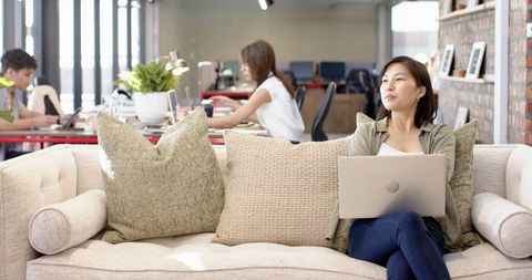 Modern Coworking Environment with Diverse Team and Relaxed Collaboration