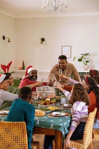 Festive African American Family Celebrating Holiday Dinner
