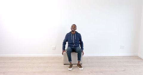 Thoughtful Man in Minimalist Room Reflecting on Life - Download Free Stock Images Pikwizard.com