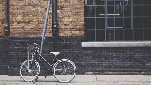 Vintage Bicycle Leaning Against Urban Brick Wall