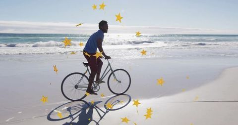 Young man cycling beachfront coast