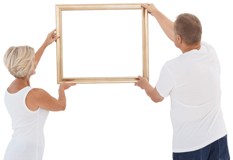 Mature couple holding transparent picture frame for home decor