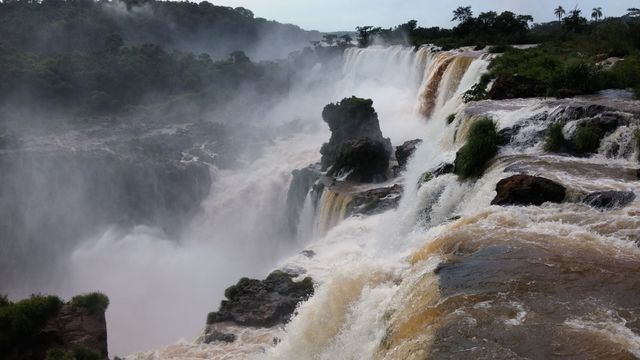 Majestic Waterfalls Cascading Through Lush Rainforest Scenery - Download Free Stock Photos Pikwizard.com