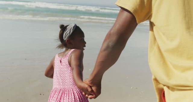African american father and daughter holding hands running on the beach - Download Free Stock Photos Pikwizard.com