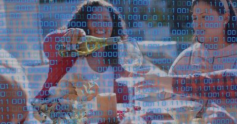 Woman pouring champagne into flutes at banquet with floral centerpiece and binary overlay