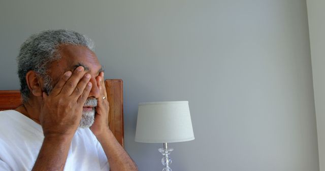 Senior Man Rubbing Eyes at Home in Morning - Download Free Stock Images Pikwizard.com