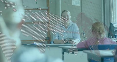 Teacher Presenting Lesson in Classroom with Dotted World Map Overlay, Students Listening