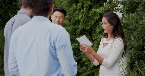 Friends Laughing and Enjoying Outdoor Wedding Celebration