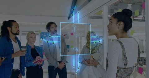 Diverse Team Collaborating with Holographic Technology in Office