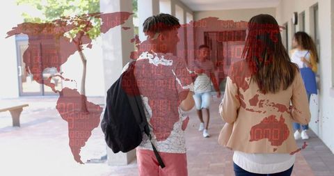 Diverse students walking college campus corridor with digital world map overlay