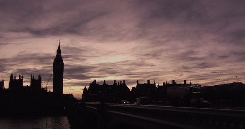 Silhouetted Cityscape at Dusk with Clock Tower and Skyline - Download Free Stock Images Pikwizard.com