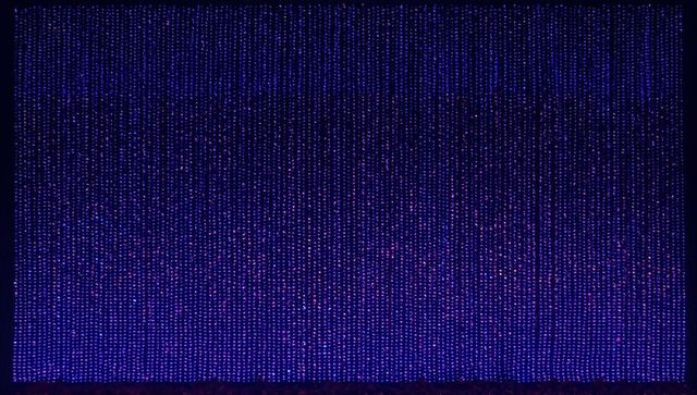 Glowing led curtain creating vertical blue violet magenta dotted grid backdrop