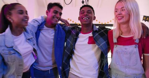 Happy Multiracial Friends Celebrating Birthday Party Indoors