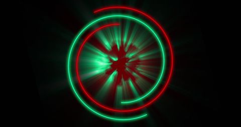 Glowing red and green circles on black background
