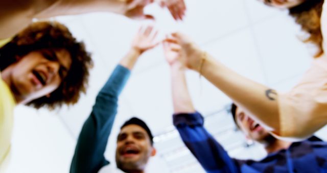 Blurred Group of People Celebrating Success with High Five - Download Free Stock Images Pikwizard.com