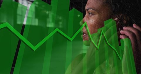 Midadult woman holding smartphone gazing right overlaying green financial chart analytics