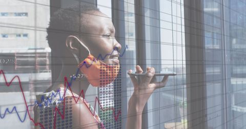 Businesswoman Analyzing Financial Data in Office during Pandemic