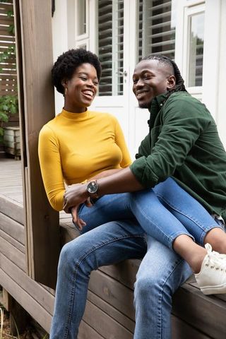 African American Couple Enjoying Time on Porch
