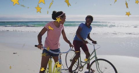 Romantic Couple Riding Bicycles on Sunny Beache with Star Overlays