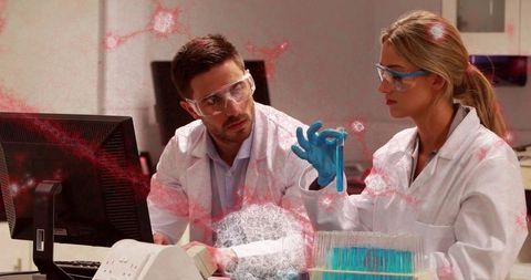 Innovative researchers analyzing at modern biotechnology lab