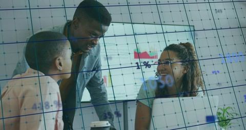 Colleagues Analyzing Business Data on Charts in Collaborative Meeting