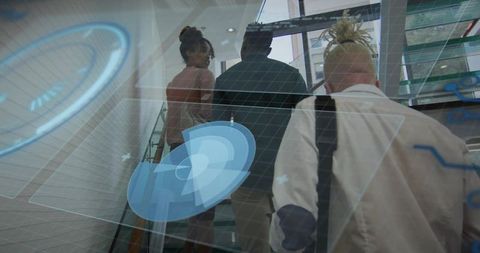 Business team ascending glass staircase with holographic hud overlay in sleek modern office