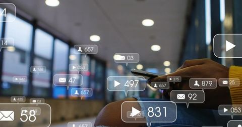 Woman scrolling smartphone at transit concourse with floating social media notifications