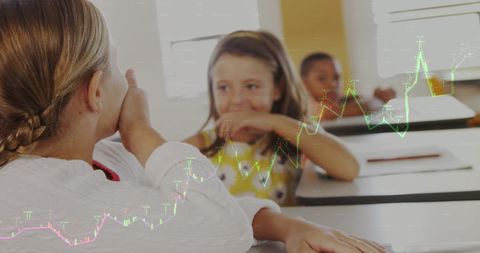 Girls discussing school concepts superimposed with graphs, digital learning
