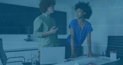 African american professionals analyzing business growth data in a conference room