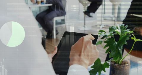 Business Professional Engaging with Tablet in Modern Office