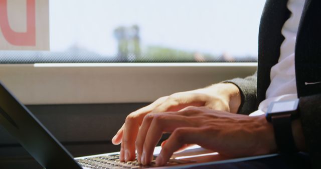 Business professional working on laptop during commute - Download Free Stock Images Pikwizard.com