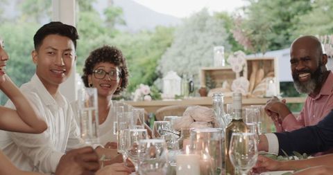 Happy Guests Toasting at Elegant Outdoor Wedding Reception