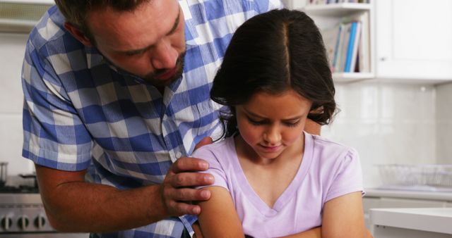 Concerned Father Comforts Upset Daughter in Kitchen - Download Free Stock Images Pikwizard.com