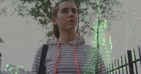 Urban Woman with Digital Data Overlay in Cityscape