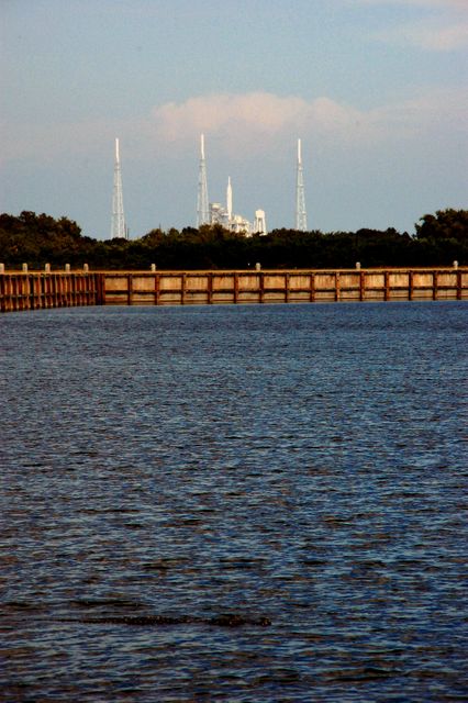 CAPE CANAVERAL, Fla. - At NASA's Kennedy Space Center in Florida, an alligator swimming in the Launch Complex 39 turn basin is oblivious to the history about to be made from Pad 39B, in the background. The flight test of NASA's Ares I-X rocket is planned for Oct. 27.  The Merritt Island National Wildlife Refuge coexists with Kennedy Space Center and provides a habitat for a variety of wildlife including 330 species of birds, 117 kinds of fish, 65 types of amphibians and reptiles, 31 different mammals, and 1,045 species of plants.  For information on the refuge, visit http://www.fws.gov/merrittisland/Index.html. For information on the Ares I-X vehicle and flight test, visit http://www.nasa.gov/aresIX.    Photo credit: NASA/Ben Smegelsky