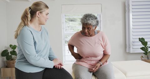 Physiotherapist Assisting Senior Woman in Rehabilitation Session - Download Free Stock Images Pikwizard.com